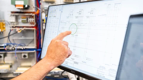 Finger points on tablt that shows a software for PDF circuit diagram